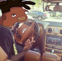 an image of a man driving a car with dreadlocks